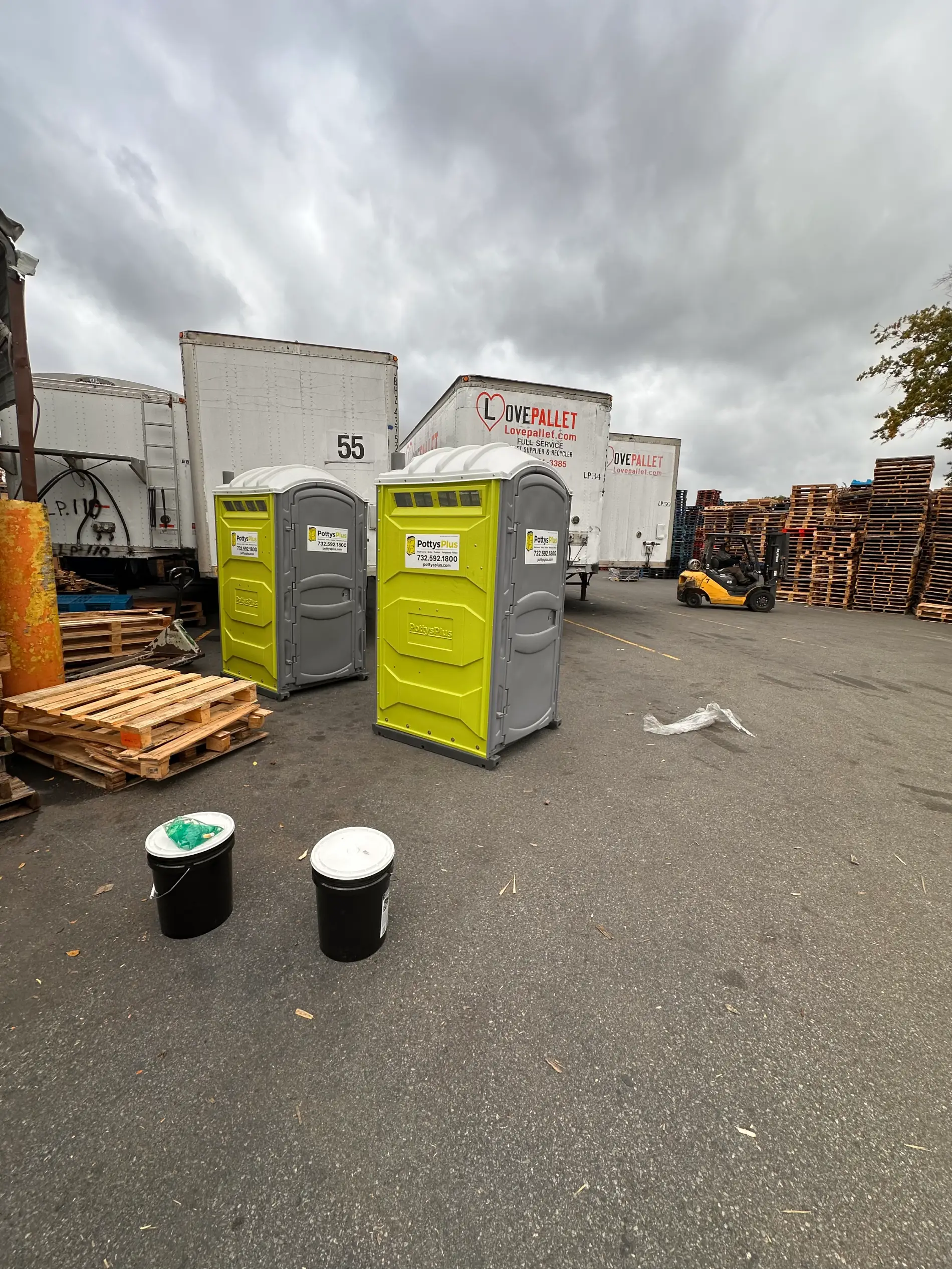 Multiple PottysPlus porta potty units deployed at a New Jersey construction job site